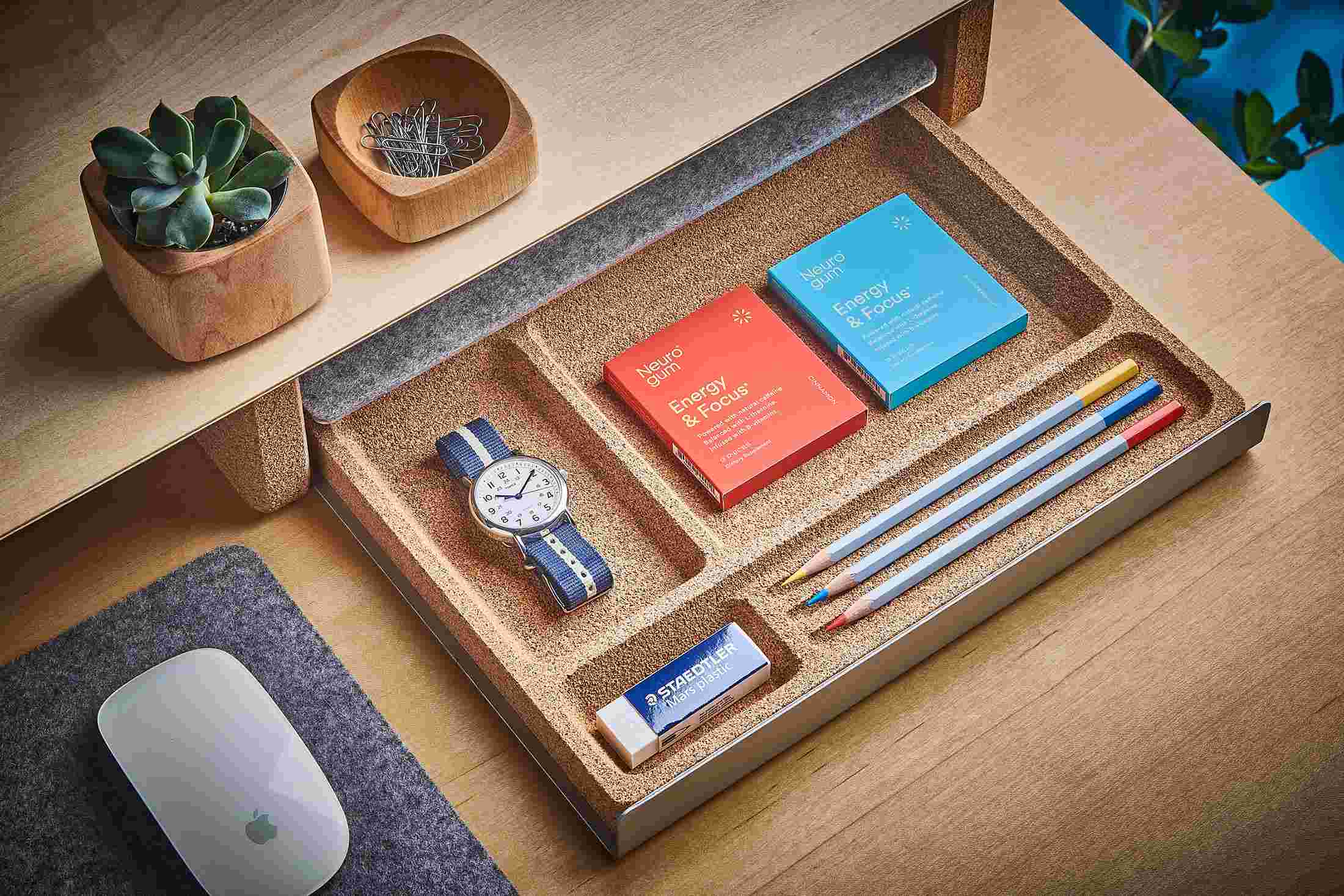The Desk Tray in natural cork, pulled out from its hiding spot under the Maple Desk Shelf.