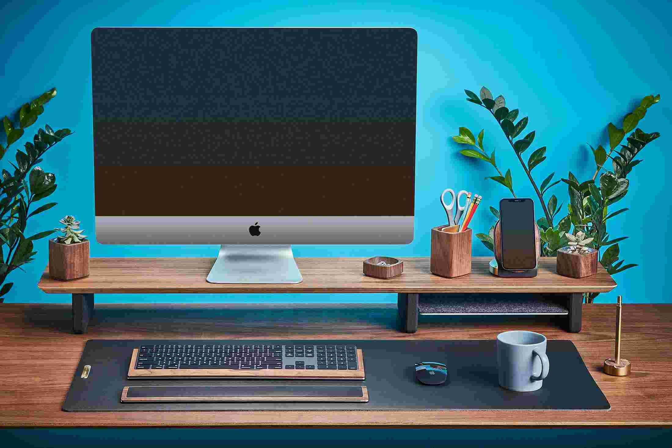 Walnut wood desk collection with desk shelf, keyboard tray, and MagSafe iPhone Stand.