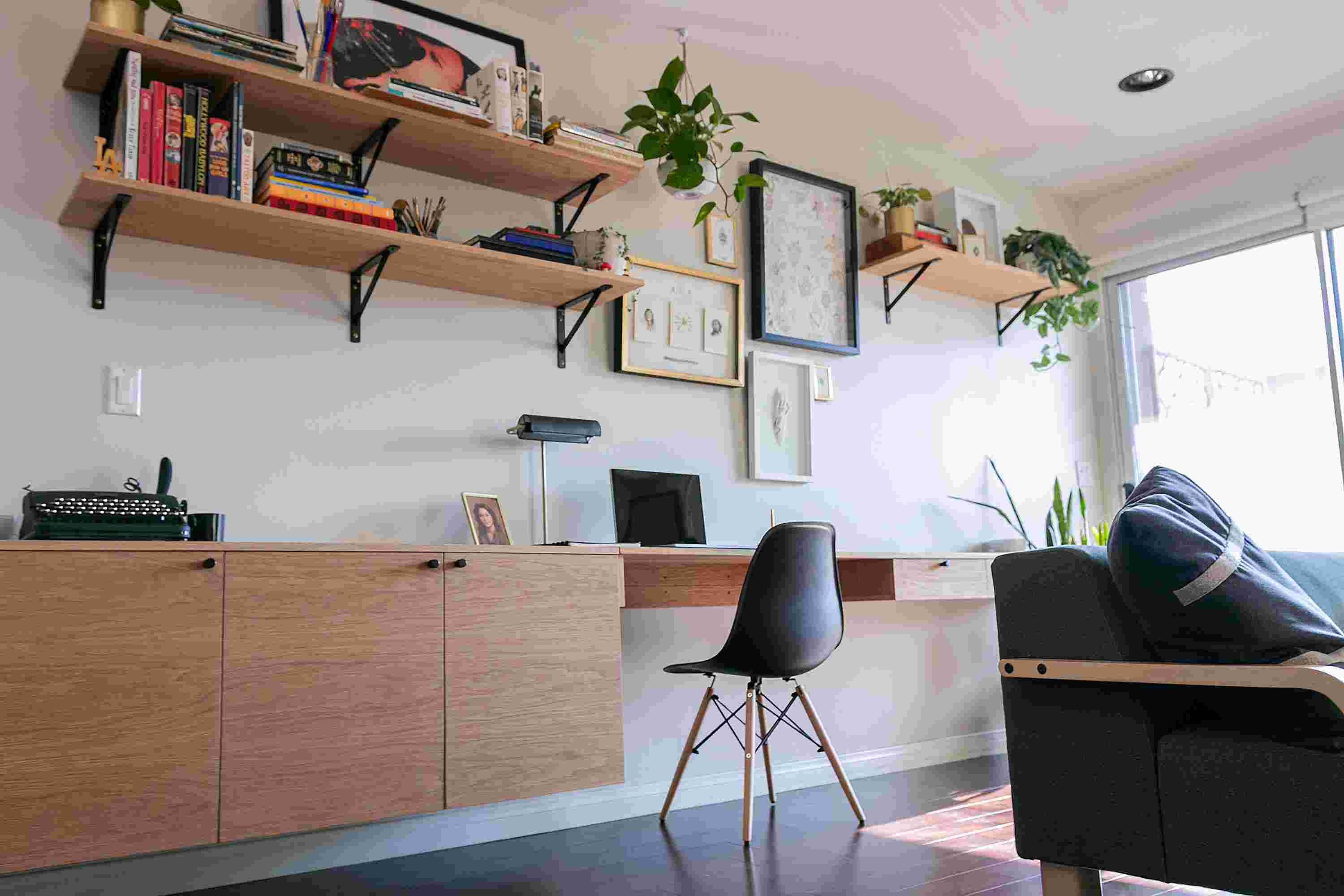 The medium and large walnut wood wall shelves in living room setting.