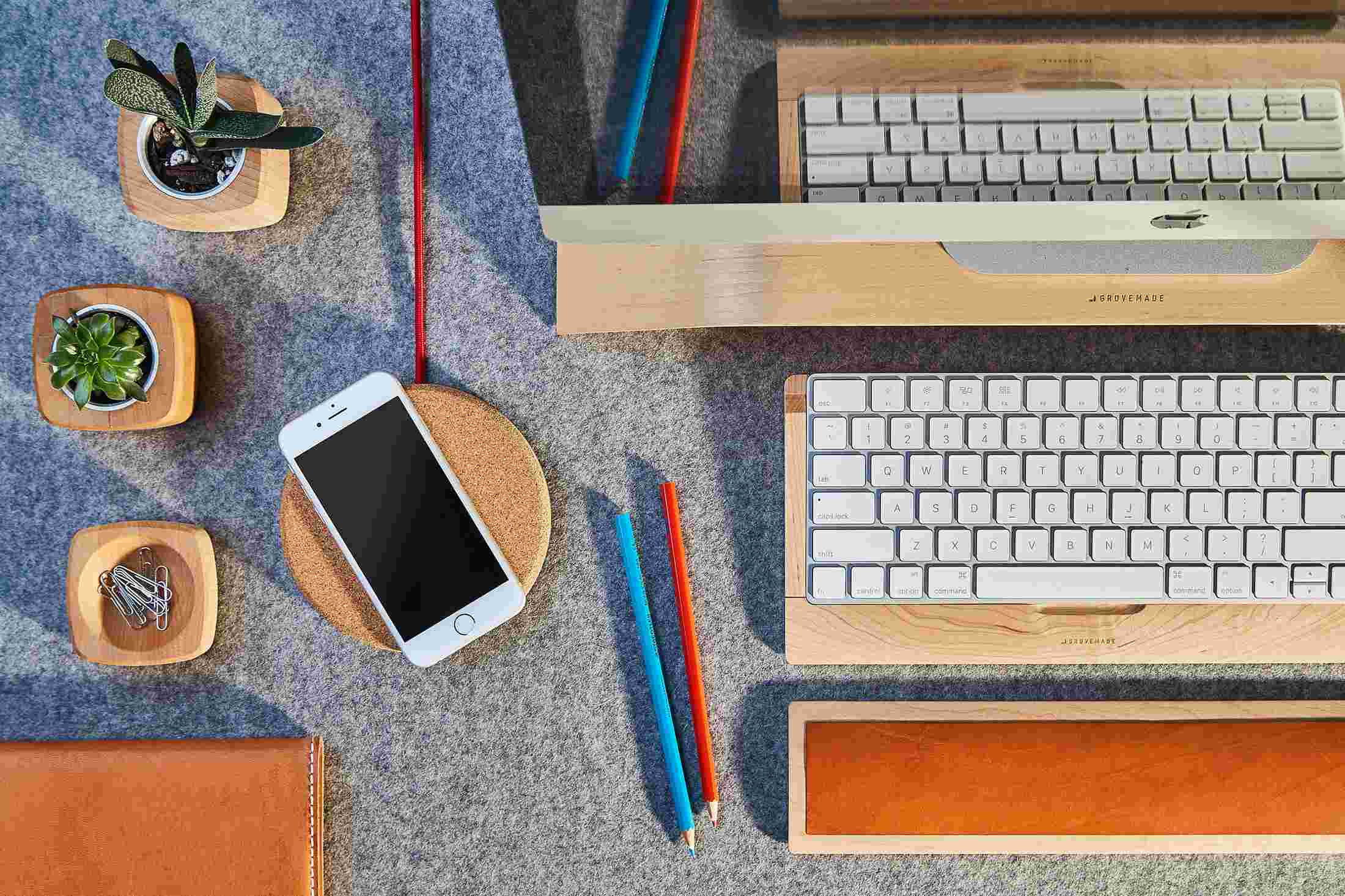 Overhead view of the Grovemade Wireless Charging Pad with cork top as part of the Maple Desk Collection.