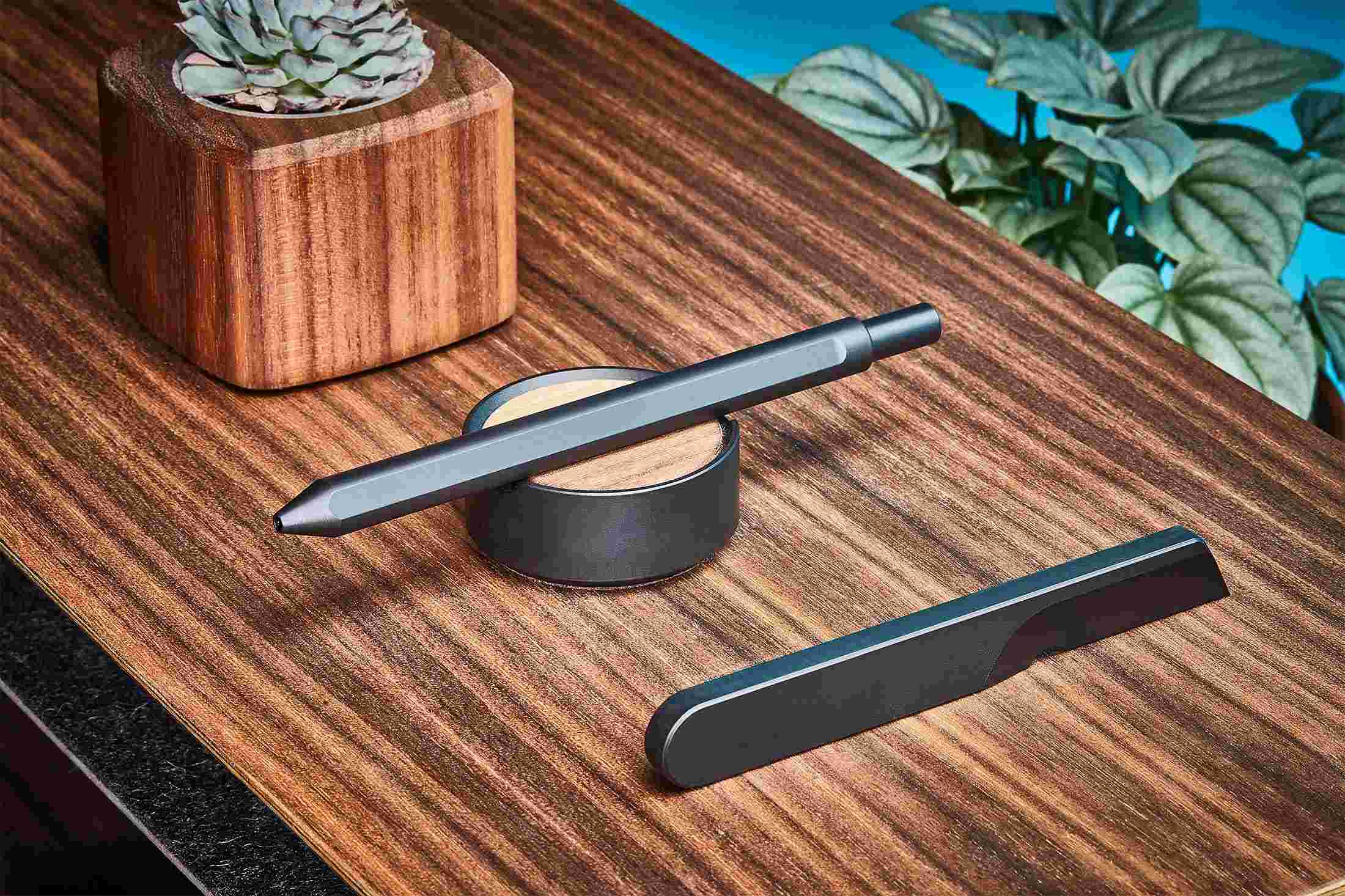 The Grovemade Black Pen and minimalist, single-piece Knife with matching wood stands.