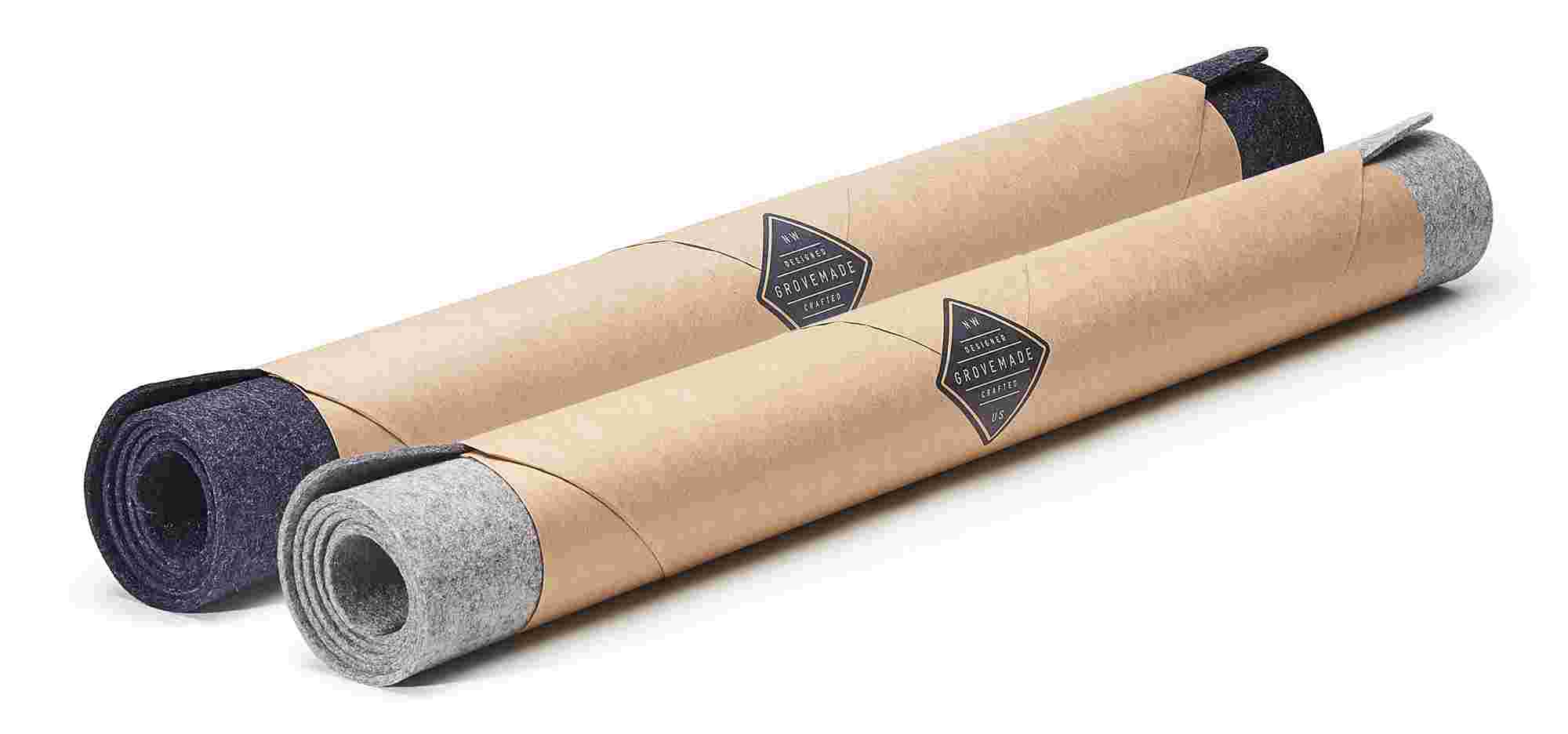 Premium Leather Pads in Black or Tan, rolled in brown craft paper.